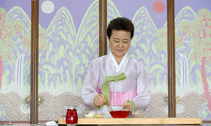 To make omija hwachae, you need to boil the seeds and let them cool for 12 hours until the juice comes out. Sugar and honey are added to make the punch.