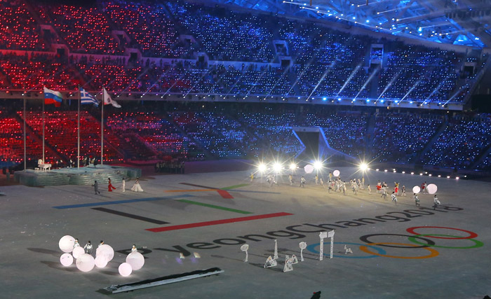 The official logo for the PyeongChang 2018 Winter Olympics appears on the rink as the Olympic flag is handed from Russia to Korea. (photo: Yonhanp News)